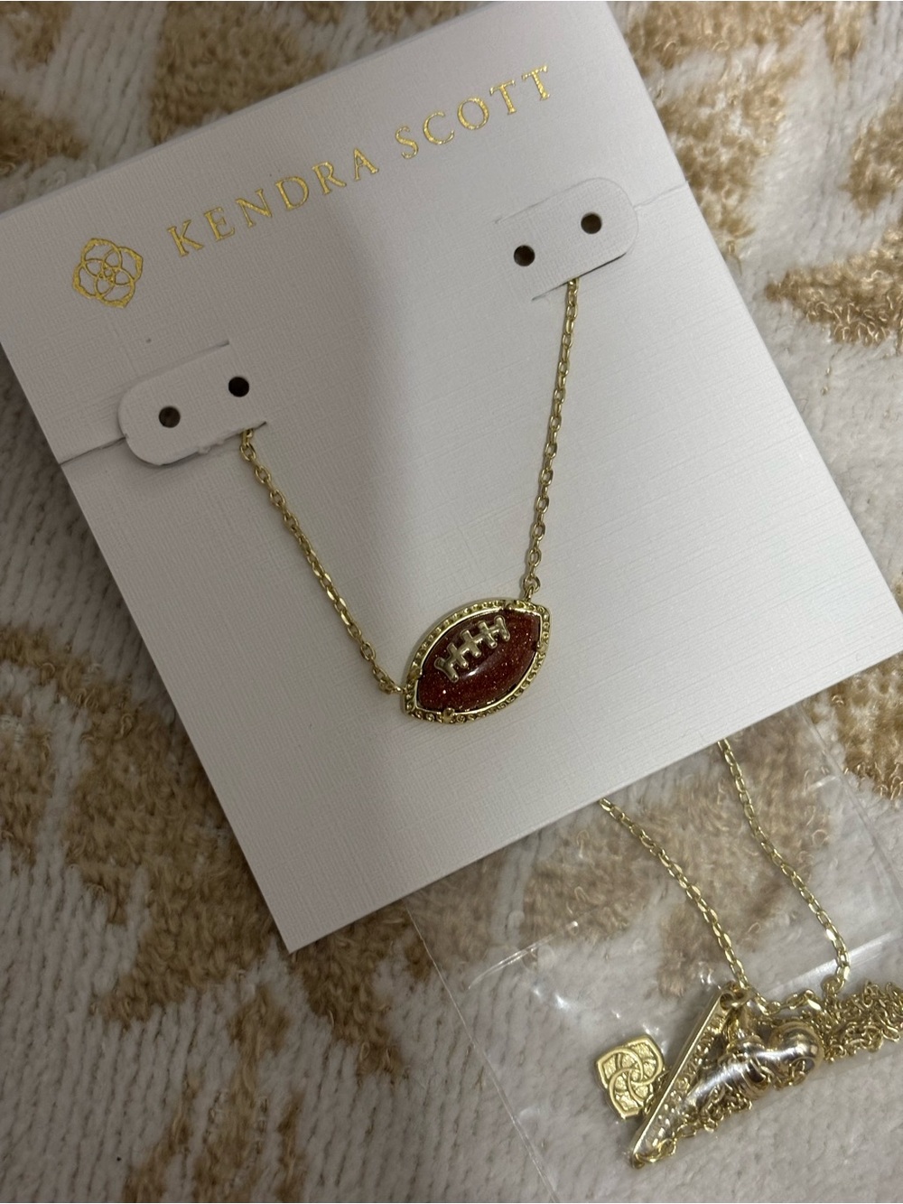 Kendra Scott Gold Necklace with Brown Glitter Football Pendant